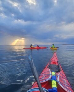 sunset sea kayak