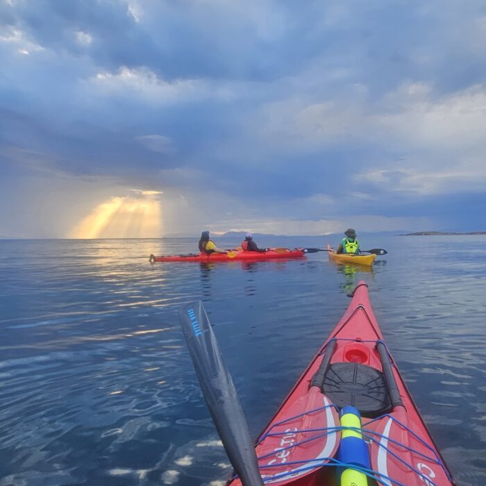 sunset sea kayak